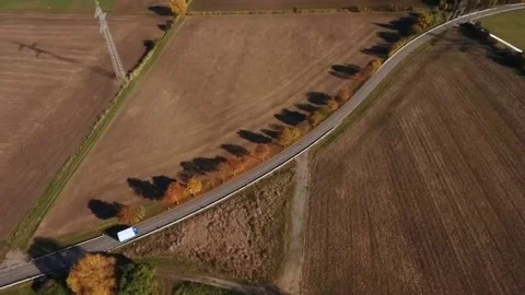 Road through autumnal fields Видео 69171608