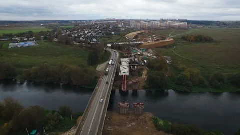 The road through the bridge going to the city. Moscow region quadcopter view Stock Footage 97785786