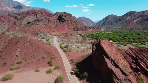 Road through eroded mountain landscape of Quebrada Las Conchas in Salta Stock Footage 293031494