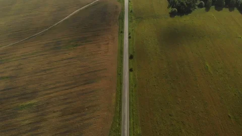 Road through a fields aerial 스톡 동영상 112875222