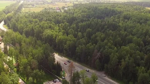 The road through the forest. Copter Shot. Stock Footage 70867365