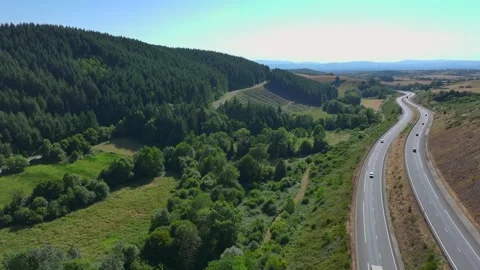 Road through forest hills Stock Footage 320929687