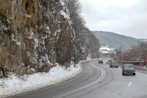 Road through forest with trees covered with snow Stock Photos