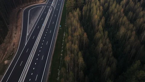 Road through the green spruce forest, aerial view. Stock Footage 107375433