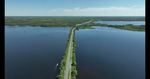 Road through a lake Stock Footage 322095148