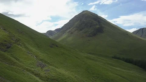 Road through mountain pass in United Kingdom Stock Footage 155464631