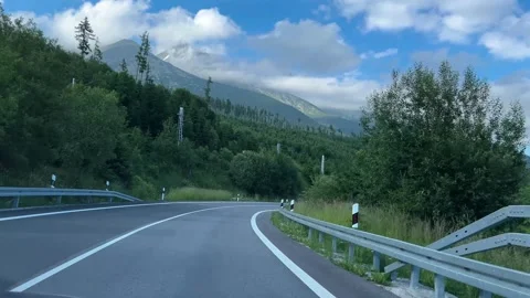 A road through mountains and forests. Car driving on the road to Tatra Stock Footage 289144589