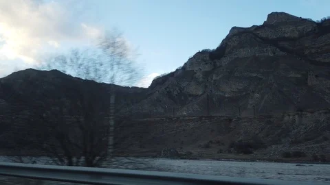 Road through the mountains of Elbrus View from the window of the car. Stock Footage 100984541