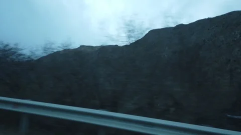 Road through the mountains of Elbrus View from the window of the car. Stock Footage 100986674