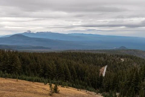 Road through pine forest seen from Crater Lake Stock Photos