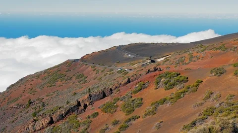 Road through the sea of clouds with Teide in the background in Teide National Stock Footage 121831579