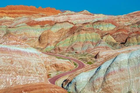 The road through the typical Danxia land form in Zhangye Danxia Geological .. Stock Photos