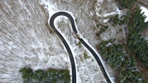 Road through the wintery forest Stock Footage 71777962