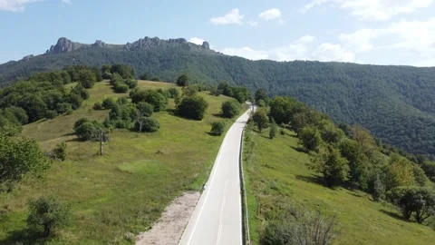 Road on top of a hill in the middle of nowhere Stock Footage 205467480