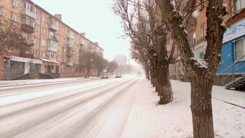 Road traffic and falling snow Stock Footage 221729295