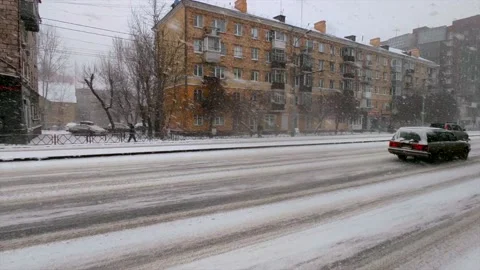 Road traffic and falling snow Stock Footage 221729327