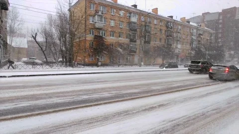 Road traffic and falling snow Stock Footage 221730347