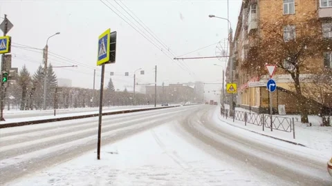 Road traffic and falling snow Stock Footage 221730893