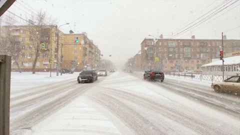 Road traffic and falling snow Stock Footage 221731179