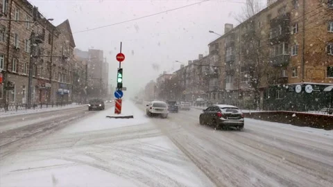 Road traffic and falling snow Stock Footage 221731467