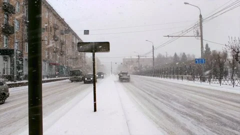 Road traffic and falling snow Stock Footage 221731484