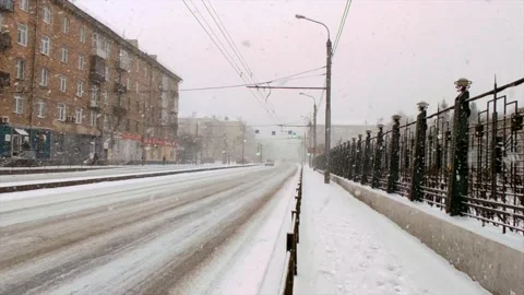 Road traffic and falling snow Stock Footage 221731610