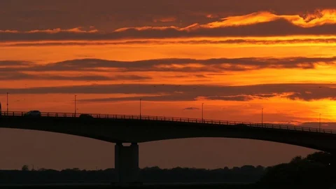 Road traffic on bridge over river estuary Stock Footage 75641960