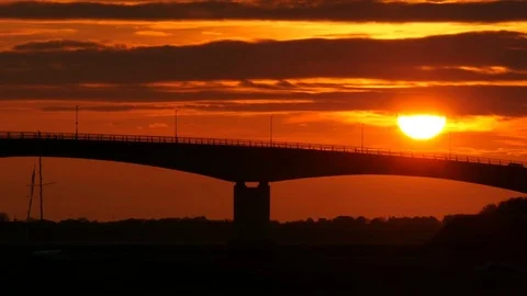 Road traffic on bridge with setting sun Stock Footage 75639776