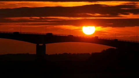Road traffic on bridge with setting sun Stock Footage 75640021