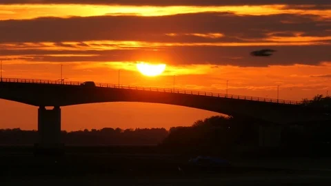 Road traffic on bridge at sunset Video stock 75639503