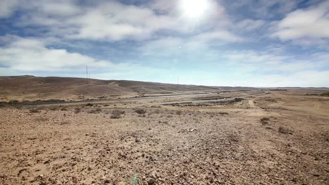 Road traffic in desert under clouds sky Stock Footage 96334066