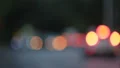 Road traffic in evening city, blurred light spots changing into car headlights HD Footage