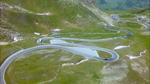 Road traffic on mountain pass summer. Aerial view. Stock Footage 70379755