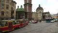 Road traffic near the Dormition or Assumption church in Lviv, Western Ukraine HD Footage
