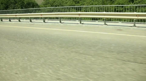 Road traffic with retaining wall Stock Footage 53064569