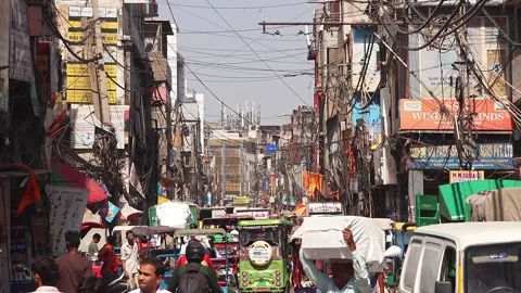 Road traffic at the small streets of Old Delhi. Stock Footage 285345626