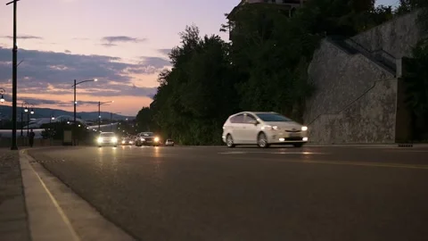 Road traffic on a sunset background. Road with passing cars on a background of Stock-Footage 197418459
