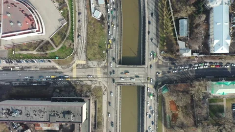 Road traffic in timelapse. View from drone. Small bridge and river. Up to down. Stock Footage 139660125