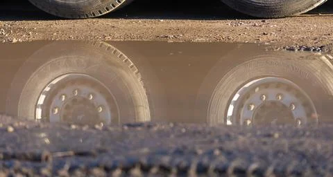 Off-road transport reflected in a puddle Stock Photos