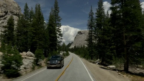 Road trip between mountains and forests Stock Footage 73897485