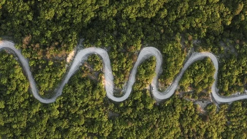 Road trip, car going through a curve road. Stock Footage 107835465