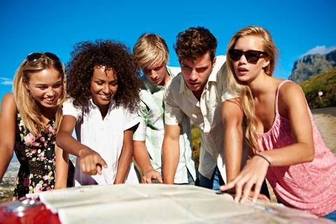 Road trip, map and group of people in nature for vacation, getaway or weekend Stock Photos