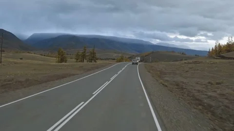 Road trip through mountainous terrain, vehicle POV shot Stock Footage 154546210
