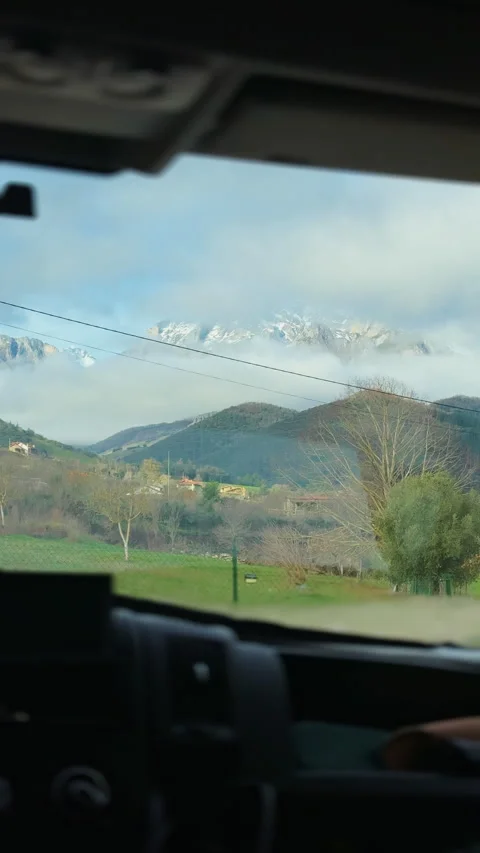 Road trip through Picos de Europa viewed from inside a car Vídeos de archivo 339219508