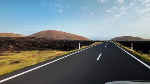 Road trip through volcanic landscape on Lanzarote, Canary Islands, Spain Stock Footage 346375769