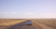 Road Trip Two Friends Driving  In Vintage Convertible Car On An Adventure Stock Footage