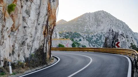 Road turn in mountains. Stock Photos