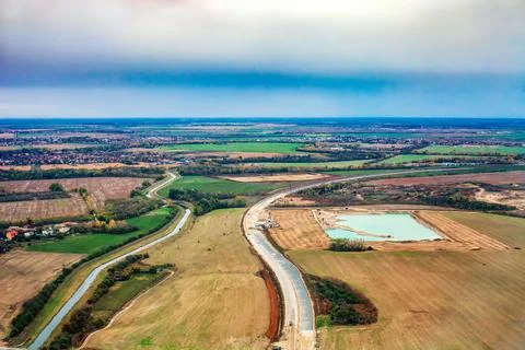 Road under construction in autumn fields near Bratislava in Slovakia, top vie Stockfoto's