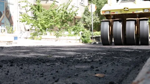 Road Under Construction, Pneumatic Tyred Roller Paver At Asphalt Road Stock Footage 65815059