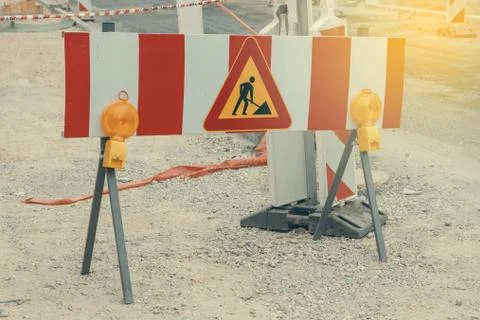 Road under construction with warning signs Stock Photos